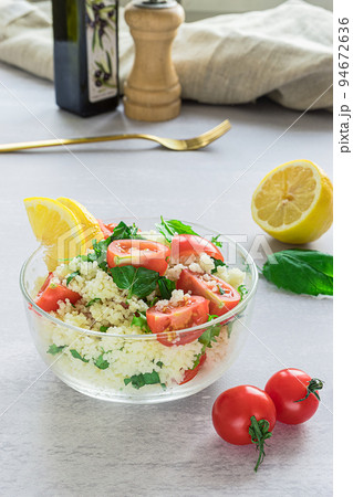 Fresh home-made tabouli, or tabbouleh salad, with its ingredients Fresh home-made tabouli, or tabbouleh salad, with its ingredients 94672636