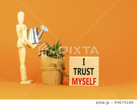 I trust myself symbol. Concept words I trust myself on wooden blocks. Businessman model. Beautiful orange table orange background. Business, psychological and I trust myself concept. Copy space. 94674166
