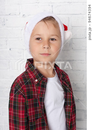 Cute little boy in the santa claus hat. Cute little boy in the santa claus hat. 94674394