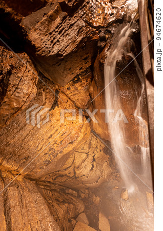 Flowing waterfall underground in Niagara Cave, MN Flowing waterfall underground in Niagara Cave, MN 94674620