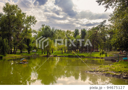 beautiful lake at the evening. Landscape - meadow, the blue sky and river beautiful lake at the evening. Landscape - meadow, the blue sky and river 94675127