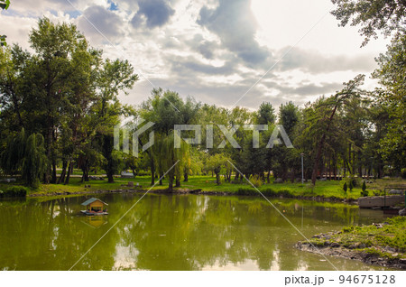 beautiful lake at the evening. Landscape - meadow, the blue sky and river beautiful lake at the evening. Landscape - meadow, the blue sky and river 94675128