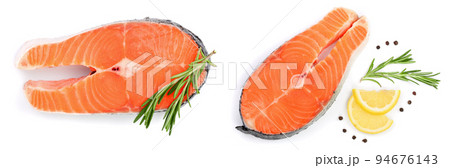 Slice of red fish salmon with lemon, rosemary and peppercorns isolated on white background. Top view. Flat lay Slice of red fish salmon with lemon, rosemary and peppercorns isolated on white background. Top view. Flat lay 94676143
