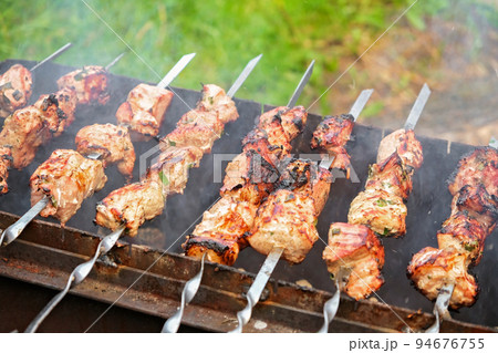 Cooking shish kebab on the grill. Cooking Cooking shish kebab on the grill. Cooking 94676755