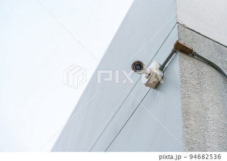 Modern CCTV camera against city and sky background. surveillance, video record and monitoring concept 94682536