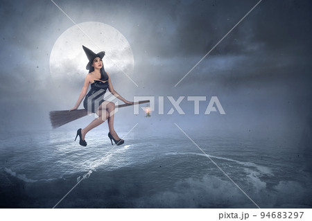 Asian witch woman with a hat flying 94683297