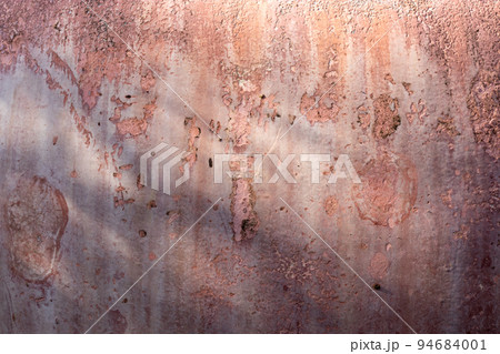 Pink cracked concrete texture background. Pink cracked concrete texture background. 94684001