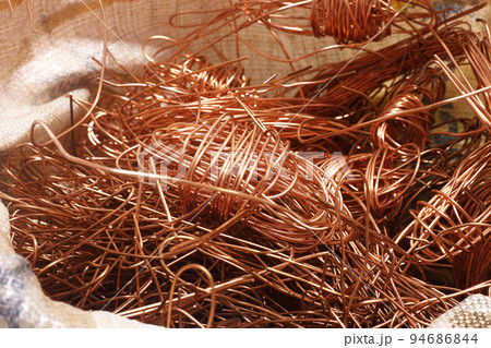 Save environment concept - Bag of electrical copper waste, scrap copper wire material for recycling business. Save environment concept - Bag of electrical copper waste, scrap copper wire material for recycling business. 94686844