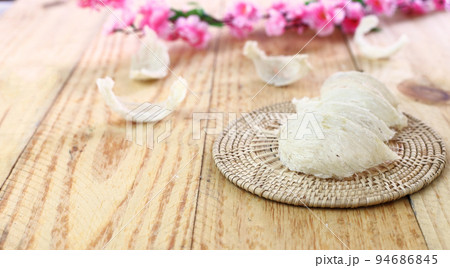 Anti aging Chinese medicine -  Group of edible bird nest - Swallow or swiftlet nest for luxury and healthy cuisine arrange on wicker. 94686845