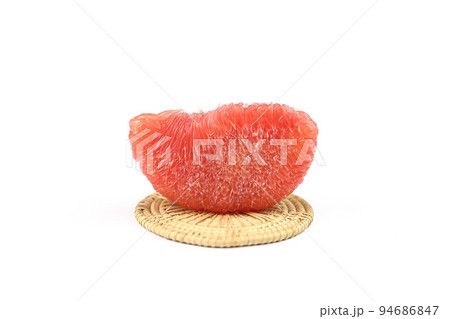 South of Thailand famous fruit - Piece of ripe red siam ruby pomelo , pummelo, grapefruit with no peel on weaven isolated on white background. 94686847