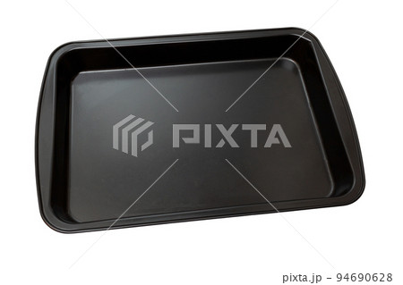 Empty black rectangular baking tray. Isolated on white background. Baking tray for baking in the oven. Top view. Empty black rectangular baking tray. Isolated on white background. Baking tray for baking in the oven. Top view. 94690628