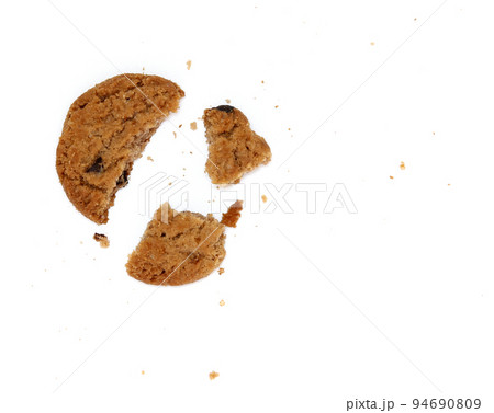 round chocolate chip cookie with crumbs isolated on white background 94690809