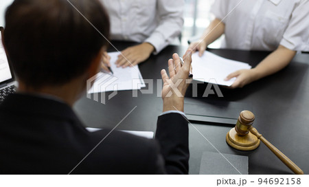 Attorney or judge provides legal advice to the client in the courtroom, Ethics in the courts include justice and impartiality, Legal consultant, Scales of justice, Law hammer, Litigation and justice. Attorney or judge provides legal advice to the client in the courtroom, Ethics in the courts include justice and impartiality, Legal consultant, Scales of justice, Law hammer, Litigation and justice. 94692158