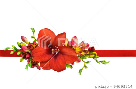 Floral arrangement with red amaryllis and freesia flowers with satin ribbon isolated on white 94693514