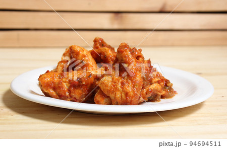 Fried Pork Skins With Red Salsa in Rustic Kitchen 94694511