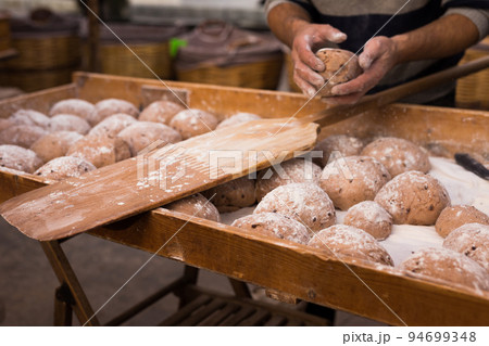 yeast dough in the form of loaves waiting to be cooked yeast dough in the form of loaves waiting to be cooked 94699348
