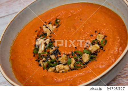 Recipe for dip with red pepper, walnuts, olive oil and cumin and chilli pepper, topped with black Recipe for dip with red pepper, walnuts, olive oil and cumin and chilli pepper, topped with black 94703597