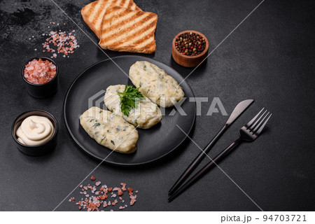 Traditional Lithuanian dish zeppelin, boiled potato dumplings stuffed with minced meat 94703721