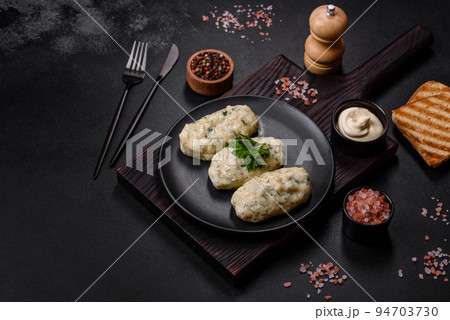 Traditional Lithuanian dish zeppelin, boiled potato dumplings stuffed with minced meat 94703730