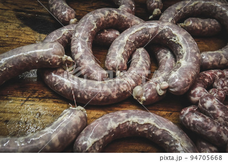 Handmade pork sausages finished on the table. Handmade pork sausages finished on the table. 94705668