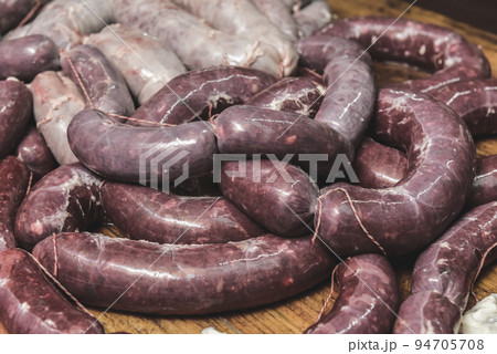 Handmade pork sausages finished on the table. Handmade pork sausages finished on the table. 94705708