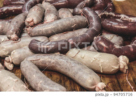 Handmade pork sausages finished on the table. 94705716