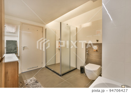 Interior of contemporary bathroom with shower and sink in minimal style in flat Interior of contemporary bathroom with shower and sink in minimal style in flat 94706427