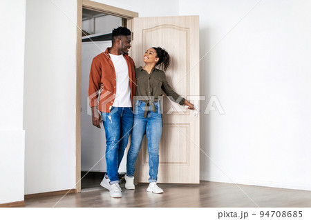 Happy Black Husband And Wife Hugging Entering Own House Happy Black Husband And Wife Hugging Entering Own House 94708685