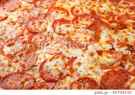 Pizza background - macro shot of italian Pepperoni pizza. 94709148