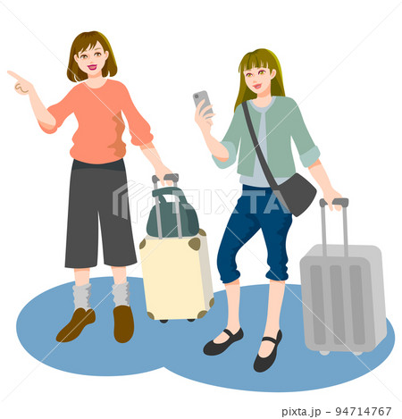 スーツケースを持って移動する旅行中の二人の若い女性 94714767