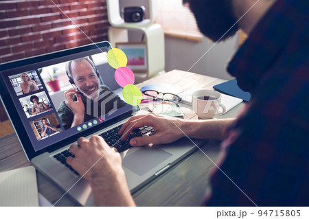 Caucasian man having video call with coworkers Caucasian man having video call with coworkers 94715805