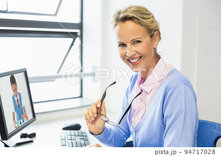 Portrait of female caucasian teacher having a video call with male student on computer at school Portrait of female caucasian teacher having a video call with male student on computer at school 94717028