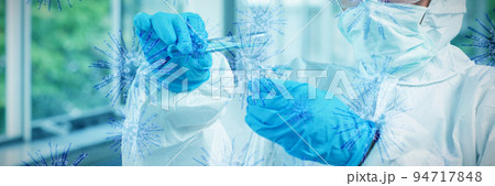 Composite image of digital image of blue coronavirus. Testing for Coronavirus pandemic 94717848