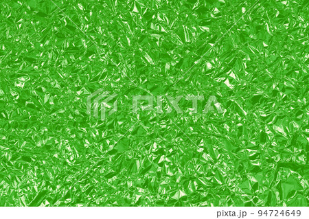 Green lime foil shiny texture, abstract wrapping paper for background and design art work. Green lime foil shiny texture, abstract wrapping paper for background and design art work. 94724649