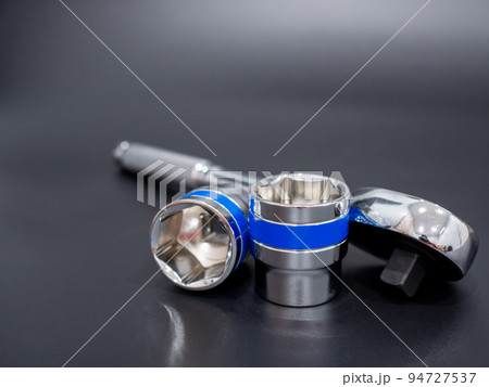 block wrench set and ratchet wrench on a black background. block wrench set and ratchet wrench on a black background. 94727537