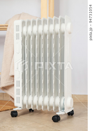 Concept of heating season, modern electric heater in room Concept of heating season, modern electric heater in room 94731054