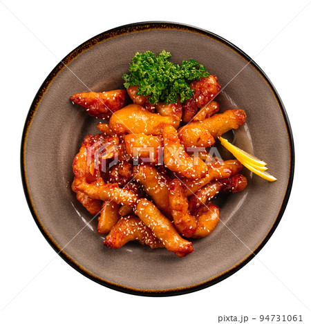 Portion of sweet and sour sauce battered chicken Portion of sweet and sour sauce battered chicken 94731061
