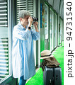 Portrait of happy senior adult elderly asia woman 60s taking pictures with photo camera for travel concept. 94731540