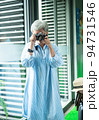 Portrait of happy senior adult elderly asia woman 60s taking pictures with photo camera for travel concept. 94731546