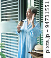 Portrait of happy senior adult elderly asia woman 60s holding paper cup, drinking coffee for travel concept. 94731551