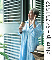Portrait of happy senior adult elderly asia woman 60s holding paper cup, drinking coffee for travel concept. 94731552