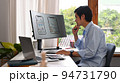 Concentred asian man developer working on mobile application software design project at modern workplace 94731790