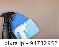 Black and white bottle and cleaning rags. 94732952