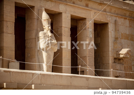 View of Hatshepsut's temple. Mortuary temple of the pharaoh of the Hatshepsut dynasty. Jeser-Jeseru is a masterpiece of ancient Egyptian architecture. Statues of ancient Egyptian pharaohs and gods. View of Hatshepsut's temple. Mortuary temple of the pharaoh of the Hatshepsut dynasty. Jeser-Jeseru is a masterpiece of ancient Egyptian architecture. Statues of ancient Egyptian pharaohs and gods. 94739436