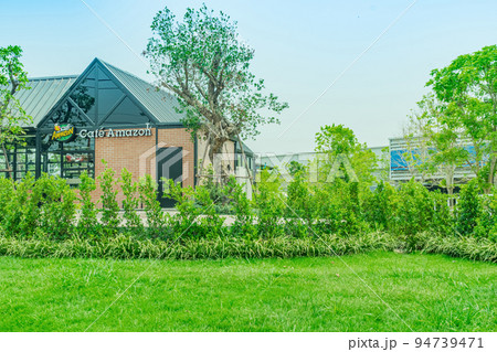 Chiang Mai, Thailand - April 13, 2020: Coffee Shop Amazon is a popular coffee shop that people buy and drink because of its delicious aroma and taste. Outside the shop has a beautiful garden setting. 94739471