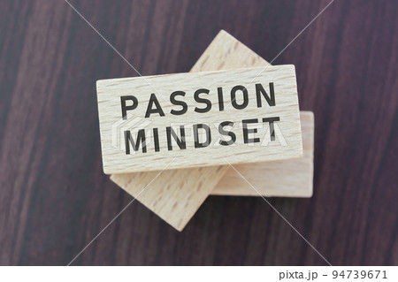 Passion mindset word on wooden block with wooden background. Passion mindset word on wooden block with wooden background. 94739671