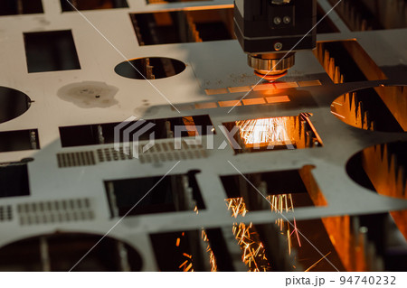 Laser cutting machine working with sheet metal with sparks 94740232