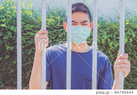 Stay at home., Coronavirus. Sick boy of corona virus  wearing mask protection and recovery from the illness in home., Self-quarantine concept. 94740444