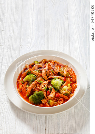 slow-cooked shredded chicken breast stew, top view slow-cooked shredded chicken breast stew, top view 94740536