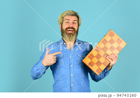 strategy, management or leadership concept. Playing chess on the Board. Board logic game. Man playing chess. back to school. chess pieces and board. competition success play. pointing finger strategy, management or leadership concept. Playing chess on the Board. Board logic game. Man playing chess. back to school. chess pieces and board. competition success play. pointing finger 94743160